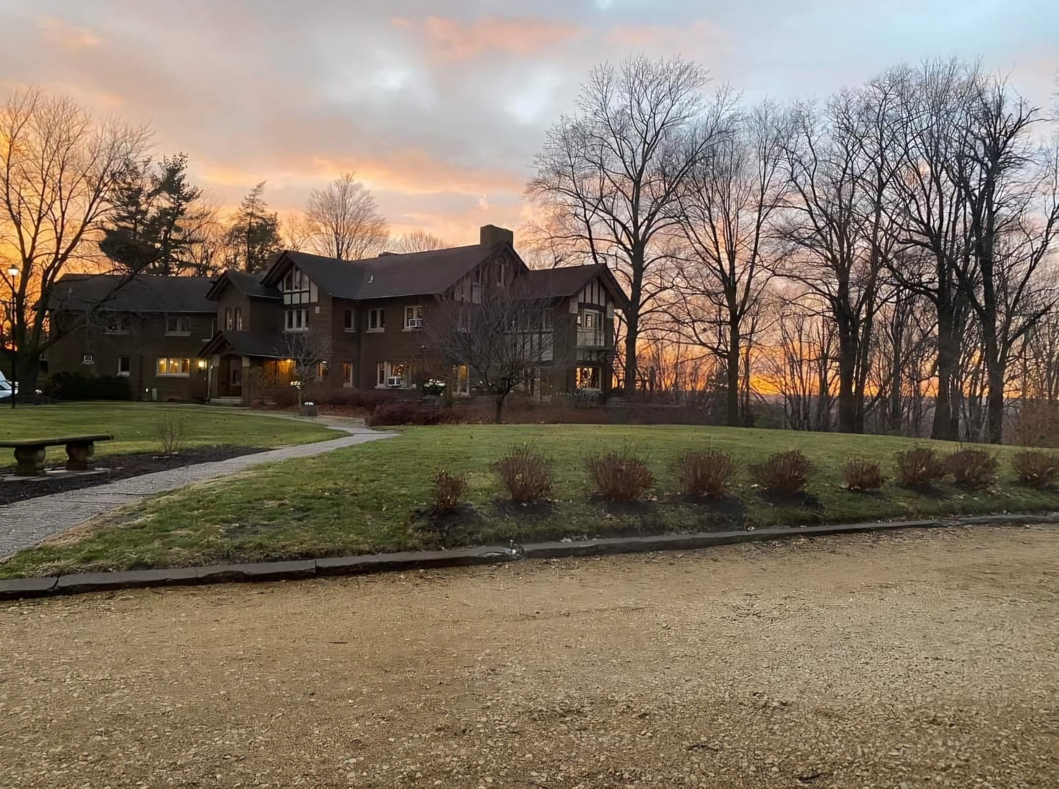 The grounds and front of the Hauberg Estate at sunset