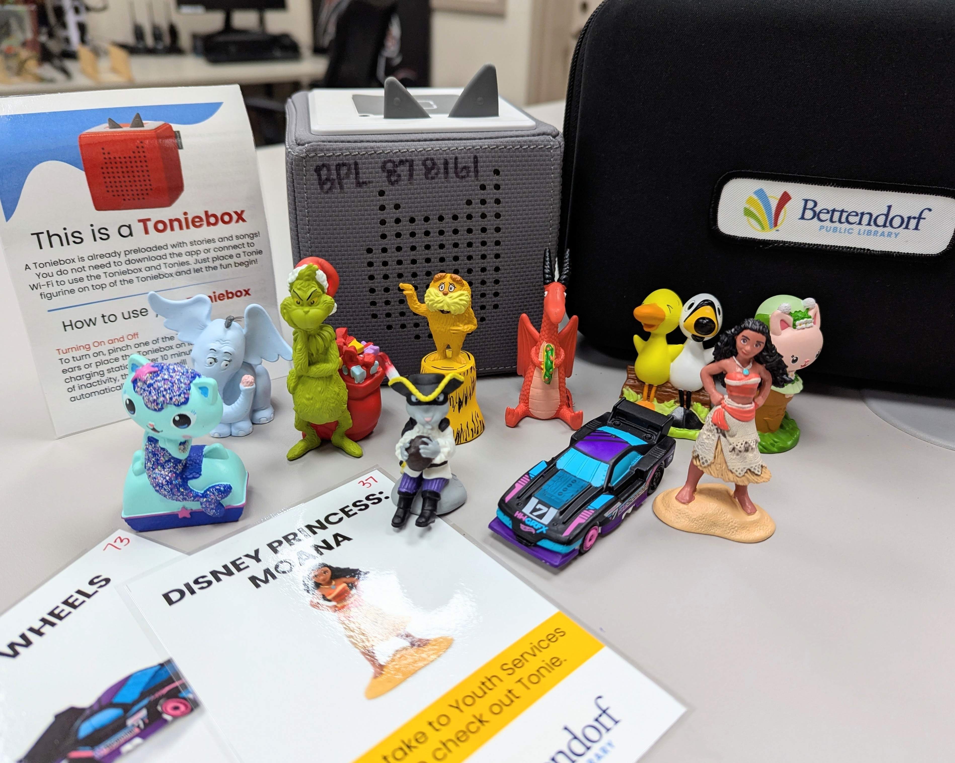 Tonie figurines with a Toniebox in the background