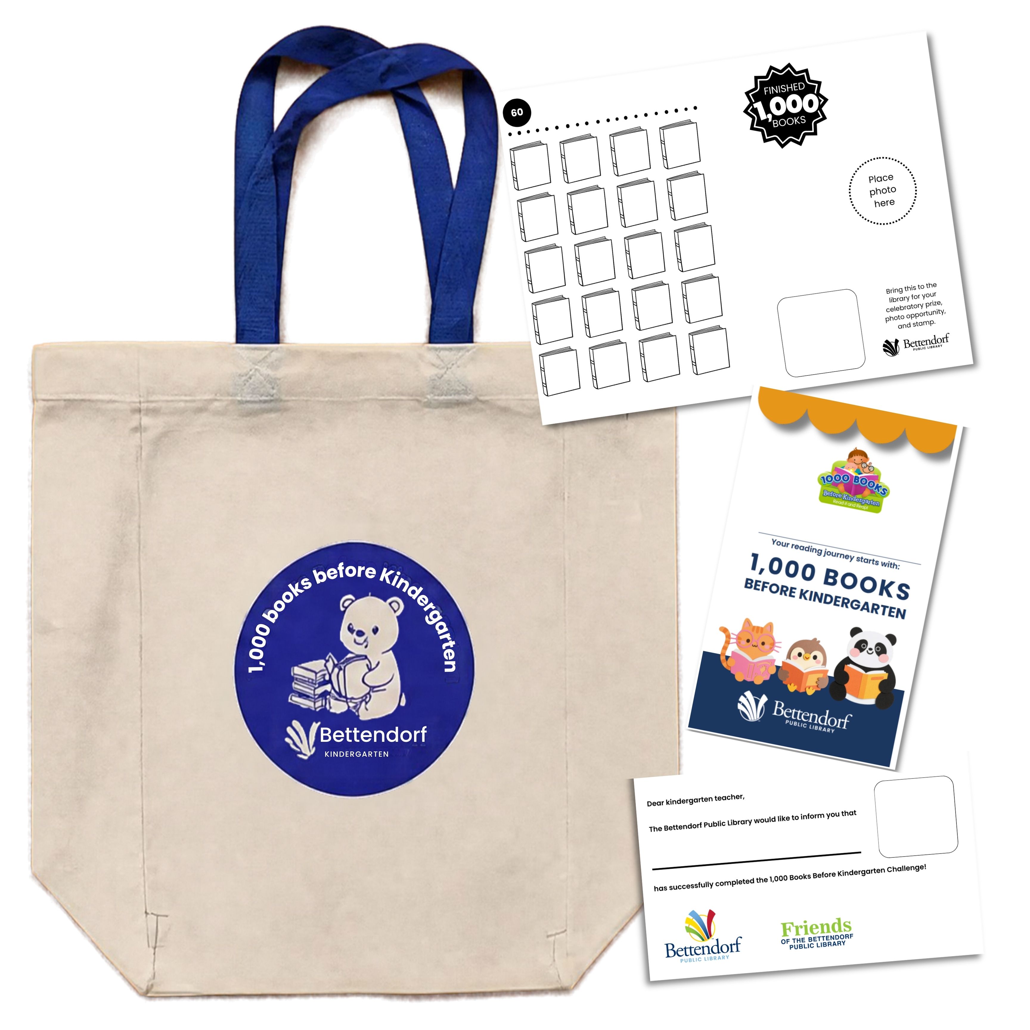 Tan tote baf featuring blue straps and center blue logo with a cartoon bear, the Bettendfor Library logo, and the text "1,000 Books Before Kindergarten," alongside loose pages from a 1,000 Books Before Kindergarten reading tracker booklet